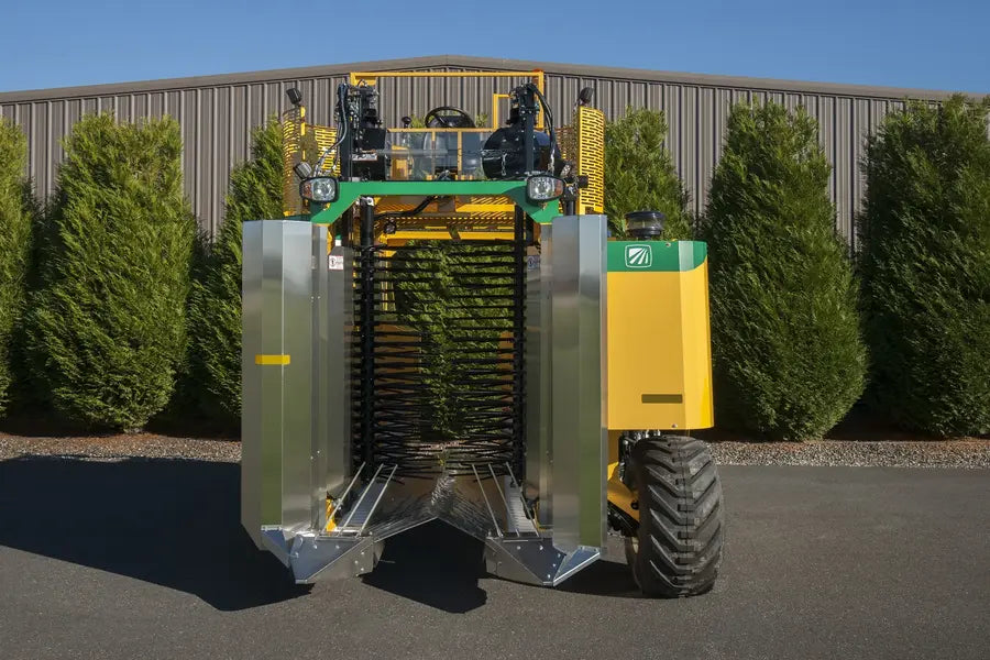 Oxbo 8040 3-wheeled bottom-load blueberry harvester