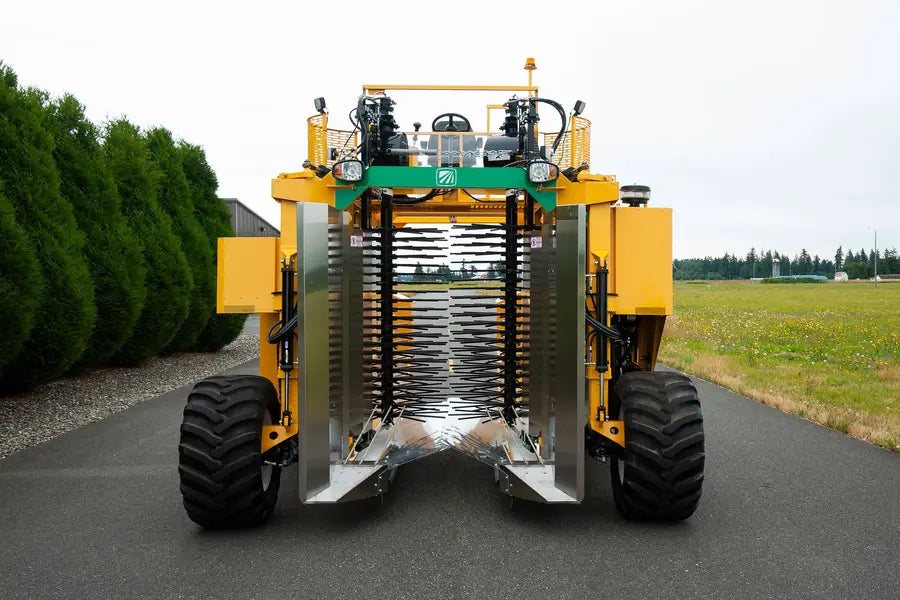 Oxbo 8140 4-wheeled bottom-load blueberry harvester